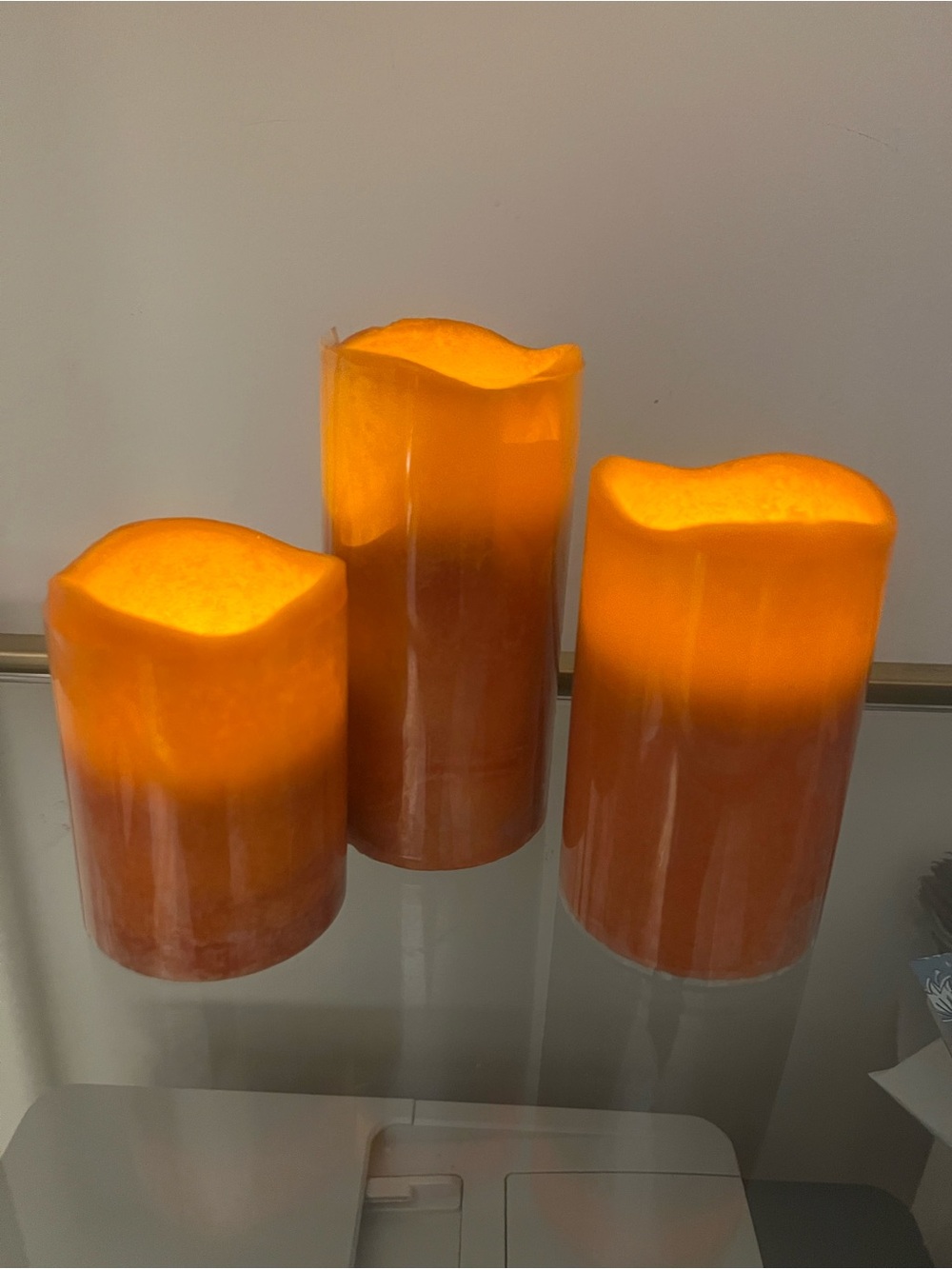 Set of 3 orange pillar LED wax candles